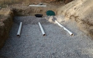 first 10 ft of pipe laid on drain rock